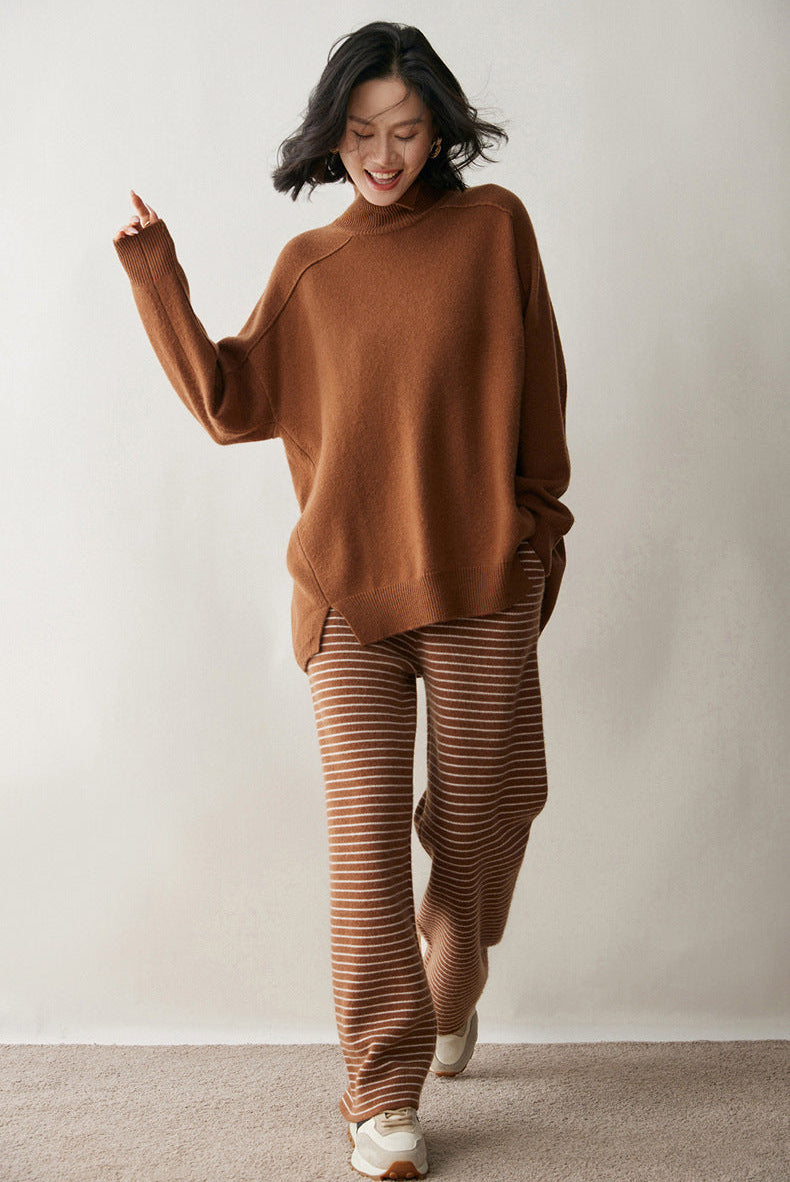 Cozy AM Vision RO cashmere turtleneck sweater for women in warm brown paired with striped pants