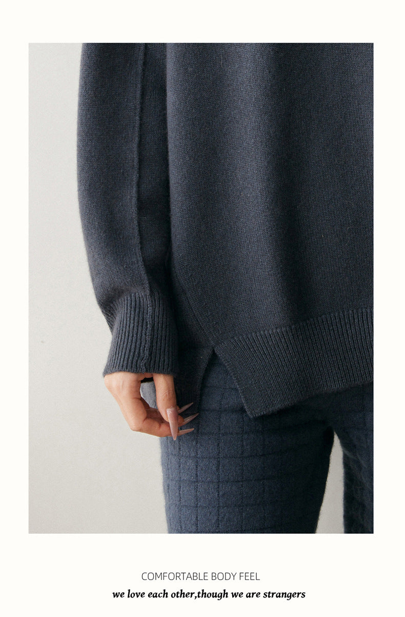 Cozy dark gray cashmere turtleneck sweater for women with ribbed cuffs and relaxed fit