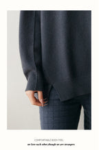 Cozy dark gray cashmere turtleneck sweater for women with ribbed cuffs and relaxed fit