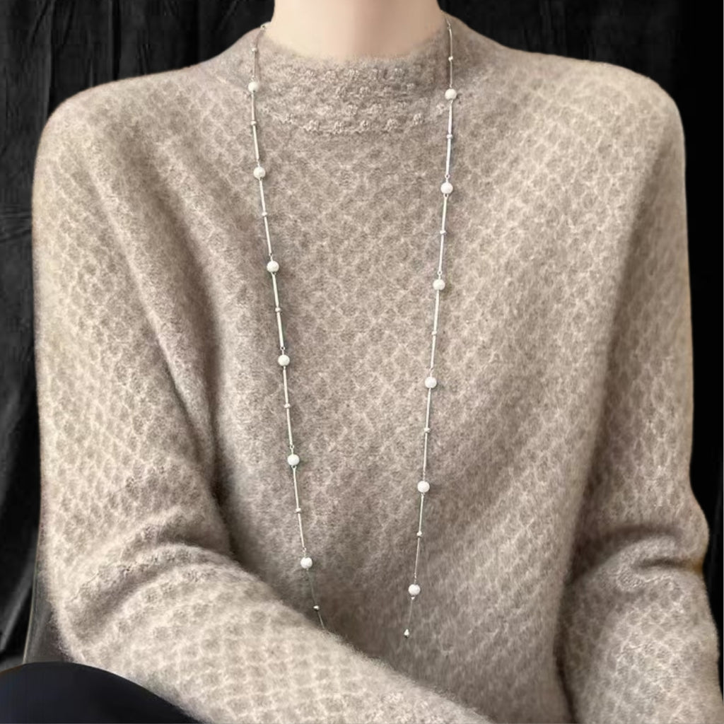 Casual Cashmere Sweater With Elegant Crochet And Semi-High Collar in soft beige with stylish pearl necklace