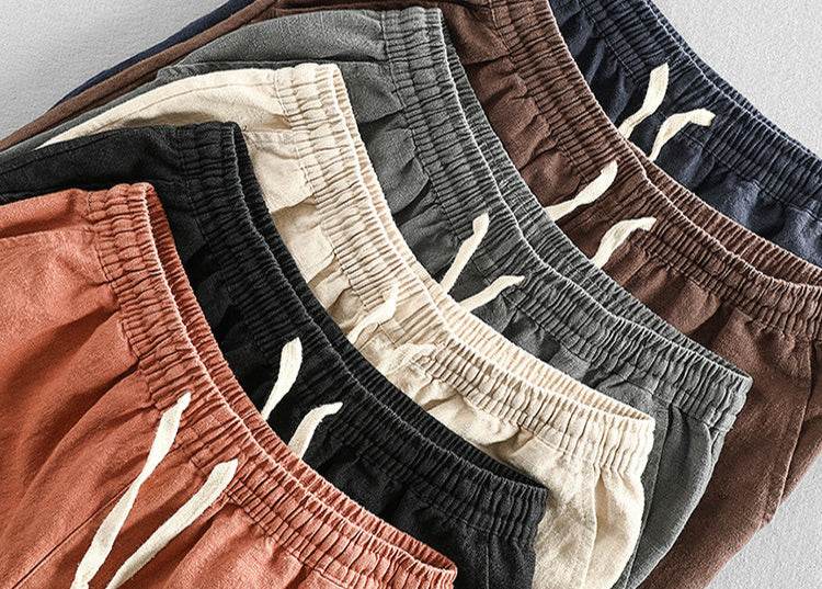 Casual Tapered Linen Pants for Men in various colors showcasing elastic waistbands and drawstrings