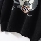 Cozy black cat cashmere sweater featuring a playful cat graphic design