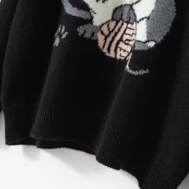 Cozy black cat cashmere sweater featuring a playful cat graphic design