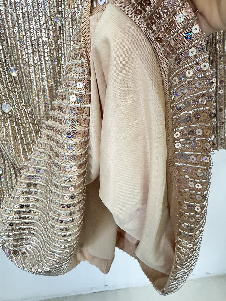 Close-up of the Celestia Embellished Mini Dress showing shimmering sequin details and soft inner lining