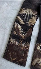 Celestial Force Black Jeans featuring intricate angel and cloud embroidery on the legs