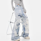 Model wearing Cloud Wash High Street Wide Leg Jeans with a trendy oversized fit and stylish design