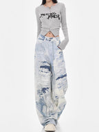 Model wearing Cloud Wash High Street Wide Leg Jeans with a cropped top for a trendy casual look