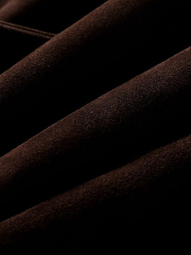 Close-up of textured brown fabric showcasing the Colette 70s Goatskin Jacket material