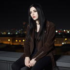 Colette 70s Goatskin Jacket in brown worn by a model at night with a city skyline in the background