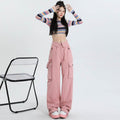Fashionable Cotton Candy Cargo Pants in pink, paired with a cropped striped top for a trendy look
