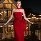 Elegant model wearing a Crimson Siren Strapless Mermaid Evening Gown with floral details and a dramatic sash