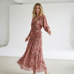Elegant model wearing a Dark Pink Silk Tie Dress in a light, minimalist studio setting