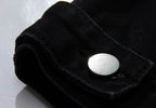 Close-up of AM Vision RO Denim Jacket with Embroidered Details showcasing the button and fabric texture
