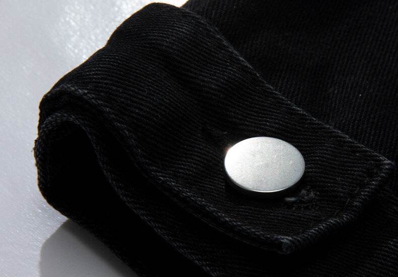 Close-up of AM Vision RO Denim Jacket with Embroidered Details showcasing the button and fabric texture