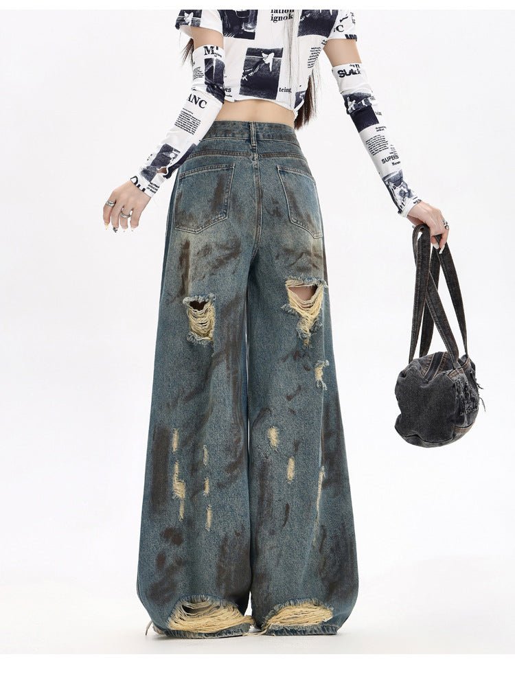 Destroyed Flared Jeans with Ripped Details and a Wide-Leg Design for a Trendy Look