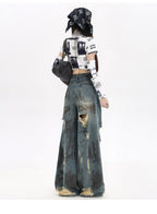 Stylish destroyed flared jeans with ripped details and a wide leg for a trendy casual look