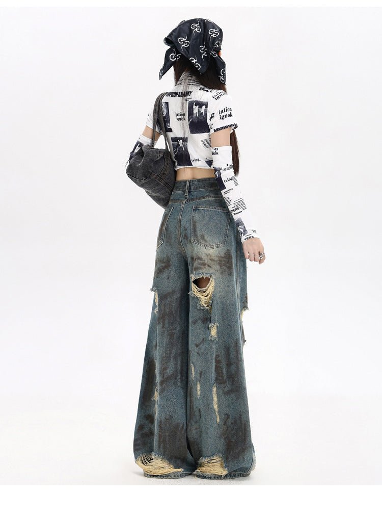Stylish destroyed flared jeans with ripped details and a wide leg for a trendy casual look