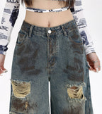 Destroyed Flared Jeans with Distressed Rips and a Vintage Wash for a Trendy Look