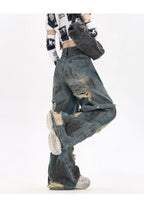 Destroyed Flared Jeans featuring distressed details and a relaxed fit for a trendy vintage look