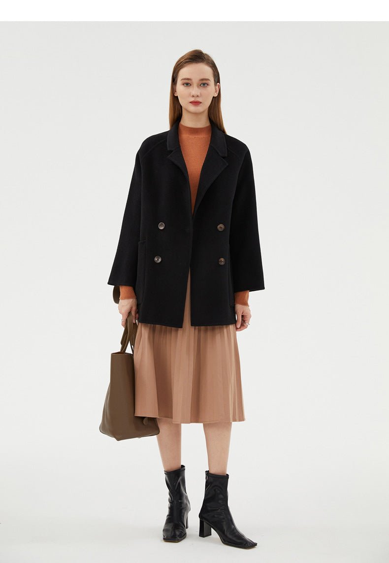 Stylish Double-Faced Wool Velvet Coat in black, layered over a tan dress with a tote bag