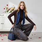 Fashion model wearing Retro Jacquard Wide Leg Denim Pants styled with a brown turtleneck and blue accessories
