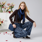 Model wearing Retro Jacquard Wide Leg Denim Pants with a brown top and blue scarf, posing stylishly