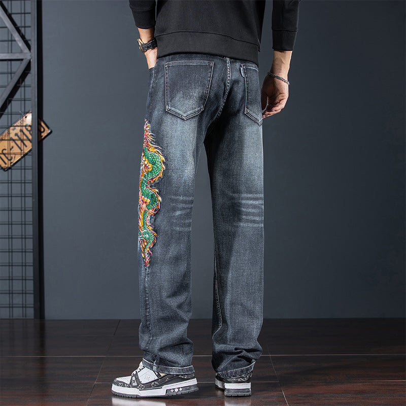 Men's Dragon Legacy Embroidered Jeans featuring vibrant dragon design on the side