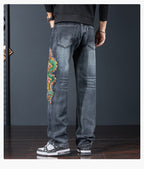 Rear view of Dragon Legacy Embroidered Jeans featuring intricate dragon design on the leg