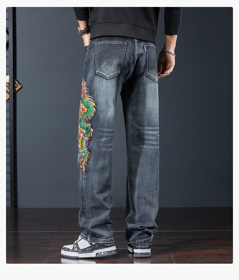 Rear view of Dragon Legacy Embroidered Jeans featuring intricate dragon design on the leg