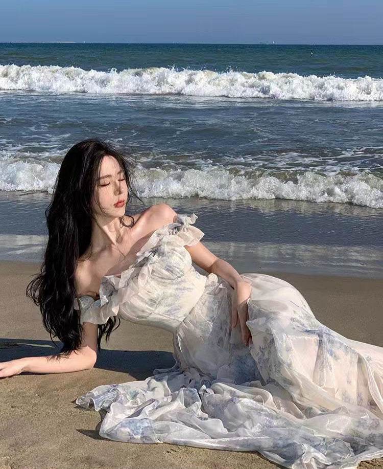 Elegant AM Vision RO Dreamy Flowy Dress with Ruffled Sleeves on a Beach by the Ocean