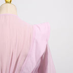 Back view of a pink Dress with Asymmetric Design and Cut-Out Details showcasing flowy fabric