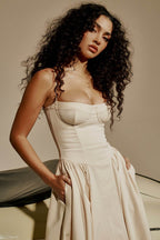 Elegant AM Vision RO dress with minimalist design featuring a fitted bodice and flowing skirt