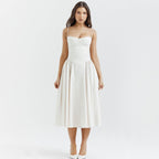 Elegant white dress with minimalist design featuring a fitted bodice and flowing skirt