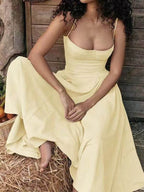 Stylish yellow dress with minimalist design, ideal for casual and elegant occasions