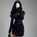 Stylish black dress with transparent inserts, featuring long sleeves and a chic silhouette