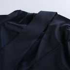 Close-up of the Elegant Bell Sleeve Dress fabric showing a smooth and luxurious texture