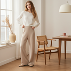 Elegant cashmere lounge pants in light beige paired with a cozy white top in a bright room