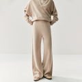 Elegant cashmere lounge pants in beige with a relaxed fit for ultimate comfort and style.