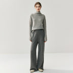 Stylish model wearing elegant cashmere lounge pants paired with a matching sweater for a chic, comfortable look