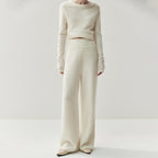 Elegant cashmere lounge pants in cream color with a relaxed fit for comfortable wear