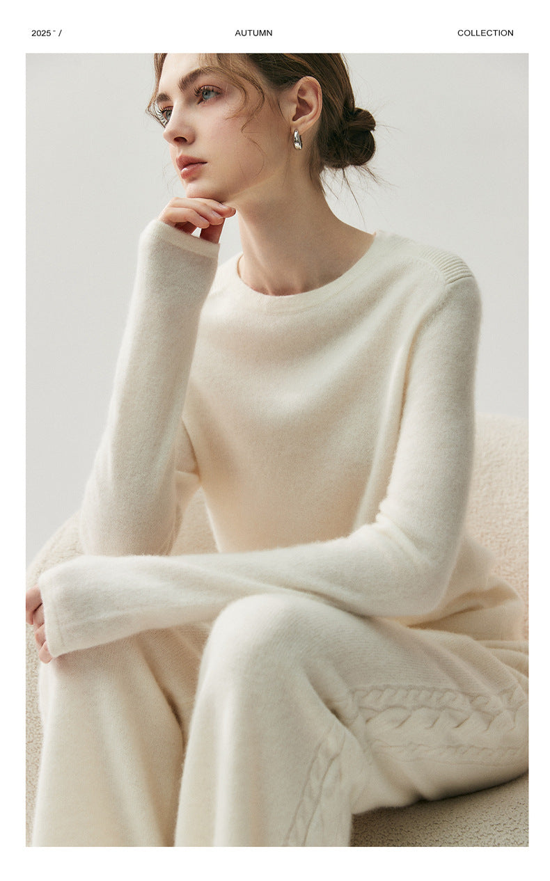 Model wearing elegant cashmere lounge pants paired with a cozy sweater in a neutral tone