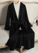 Elegant Wool And Cashmere Coat With Fitted Cut And Suit Collar, styled on a mannequin on a sofa