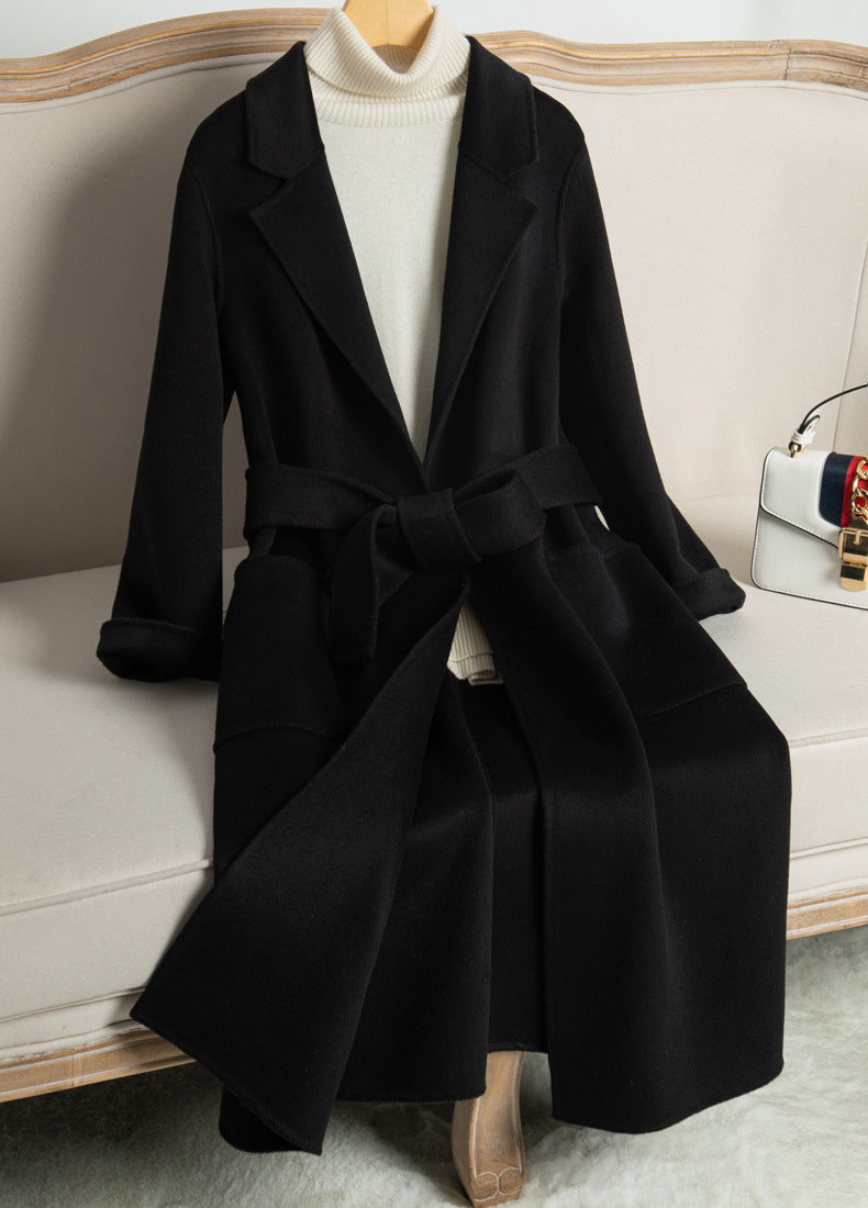 Elegant Wool And Cashmere Coat With Fitted Cut And Suit Collar, styled on a mannequin on a sofa
