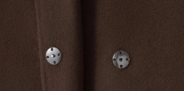 Close-up of Elegant Wool And Cashmere Coat With Fitted Cut And Suit Collar showing fabric and button details