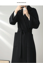 Eloane Elegant Ripple Wool Coat in Black with a Stylish Belt and Cozy Pockets for Autumn Fashion