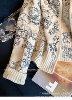 AM Vision RO Emblem Knit Zip Jacket with floral design and ribbed cuffs for stylish layering