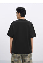 Back view of a black AM Vision RO Embroidered Bear T-Shirt designed for casual style