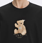 Black AM Vision RO T-Shirt featuring an Embroidered Bear T-Shirt design with a playful teddy bear.