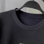 Close-up of AM Vision RO Embroidered Bear T-Shirt with a round collar and soft fabric texture