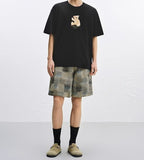 Black T-Shirt featuring an Embroidered Bear T-Shirt design with a playful bear graphic on the front